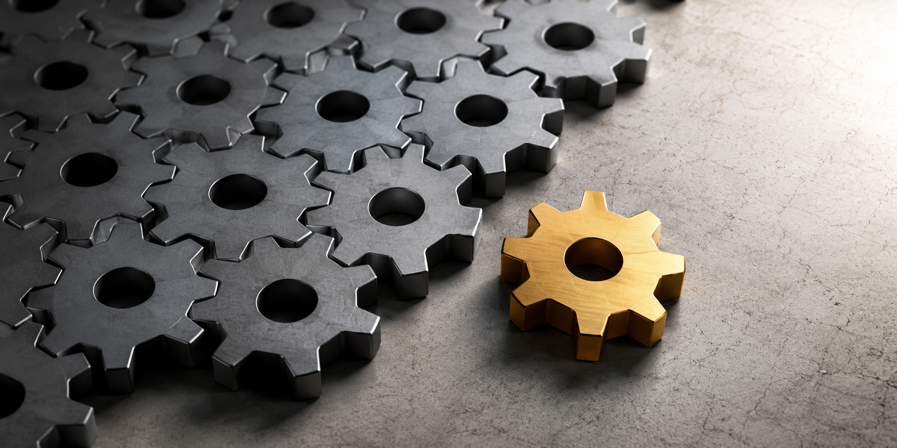 A single gold gear positioned outside a row of identical gray gears, illustrating how innovative ideas and people are often excluded by established systems.
